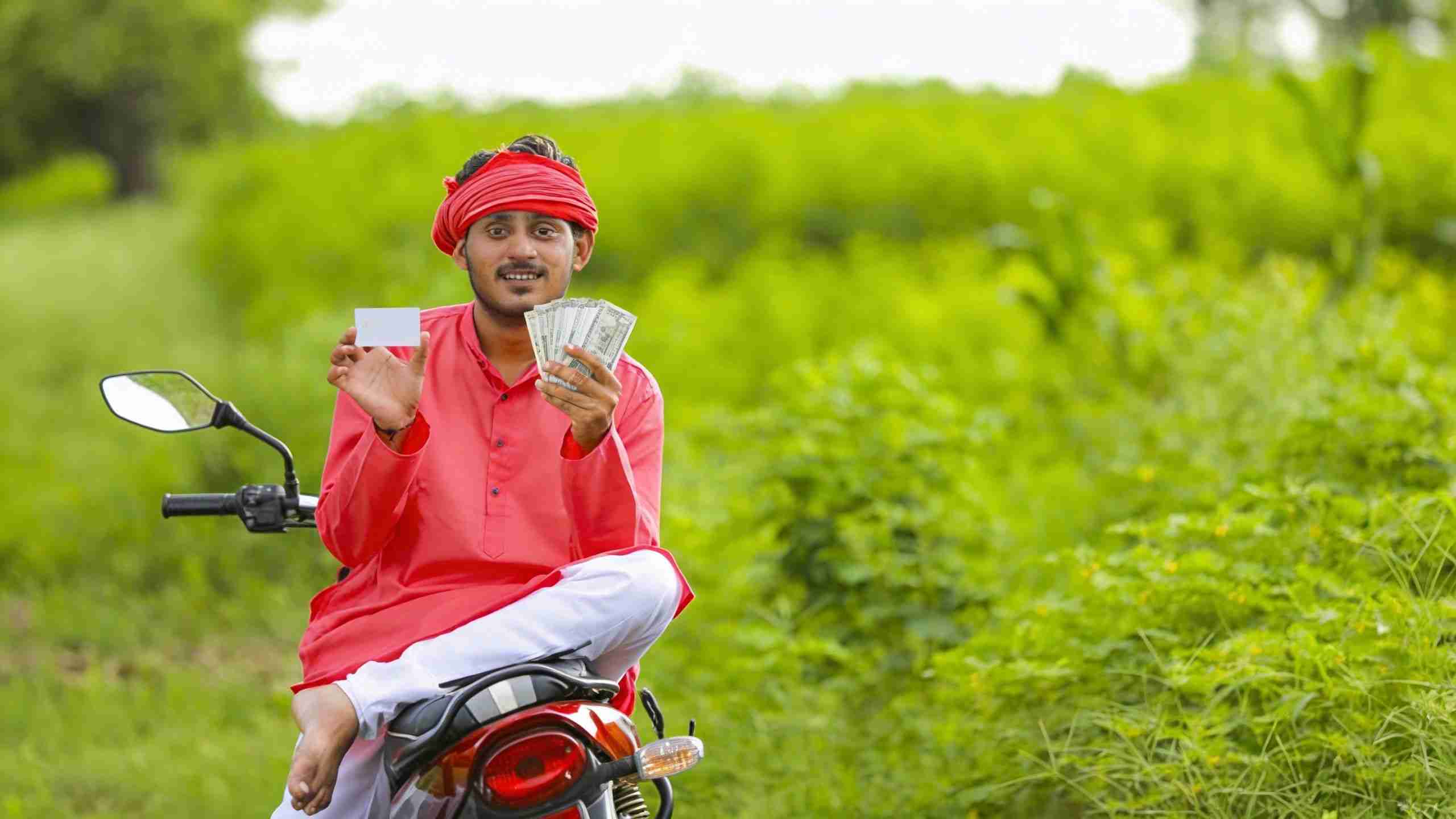 Farmer investing in better seeds and irrigation through affordable agricultural credit