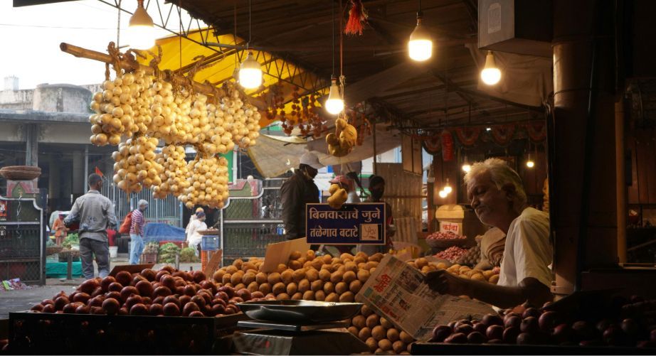 Indian farmer harvesting crops representing fair agricultural market prices in India